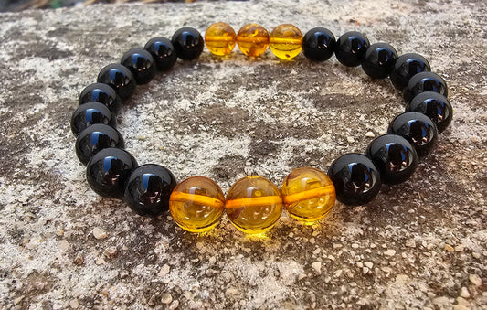 Bracelet Onyx & Ambre
✨ Protection, ancrage & lumière